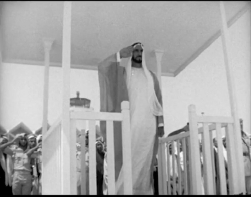 Black-and-white archive frame before restoration
